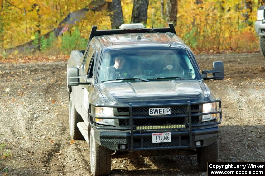 A Chevy Silverado Pickup sweep vehicle comes through the spectator location on SS9, Arvon-Silver I.