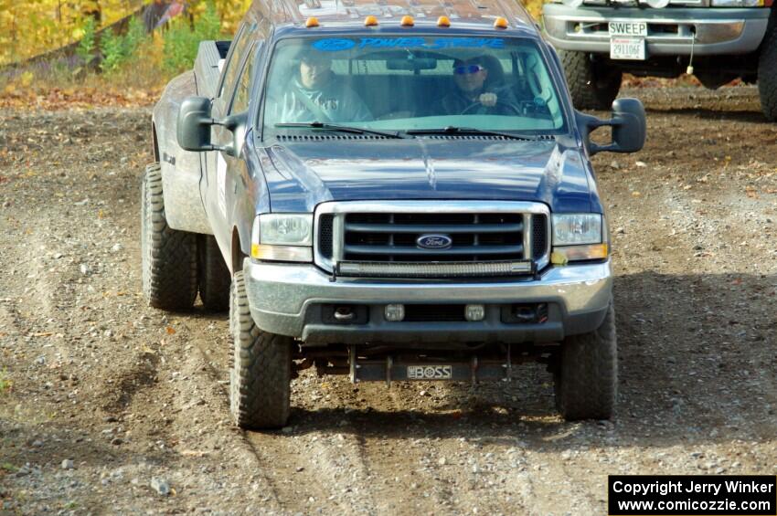 A Ford F-350 Pickup sweep vehicle comes through the spectator location on SS9, Arvon-Silver I.