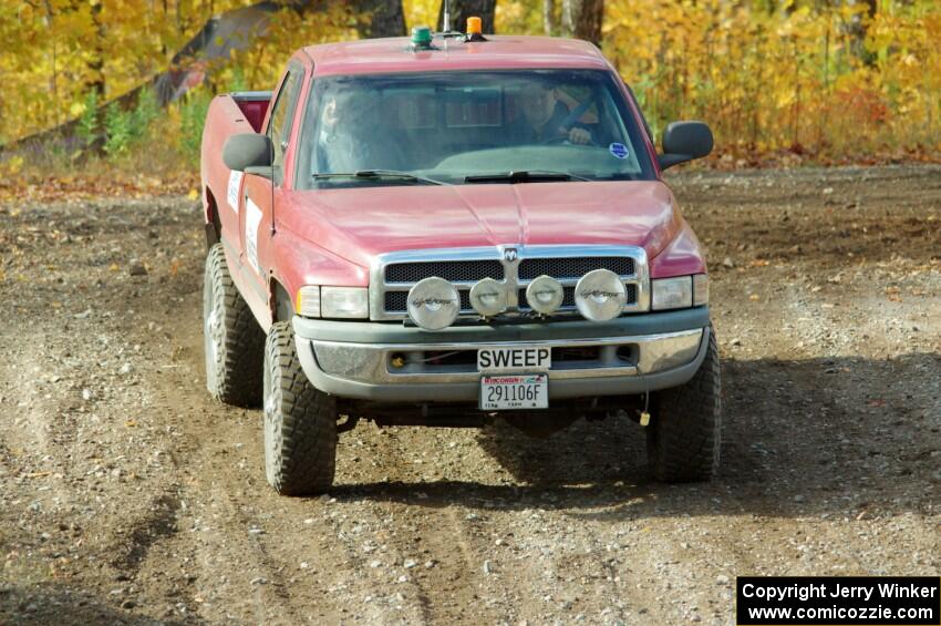 A Dodge Ram Pickup sweep vehicle comes through the spectator location on SS9, Arvon-Silver I.