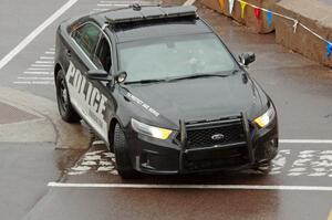 A Ford Taurus police cruiser does a pre-check of SS15, Lakeshore Drive.