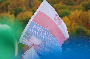 A spectator flies the Fetela Rally Team flag on SS15, Lakeshore Drive.