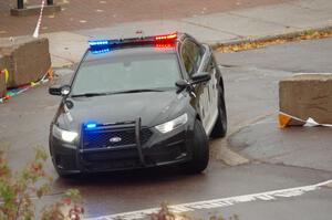 A Ford Taurus police cruiser does a pre-check of SS15, Lakeshore Drive.