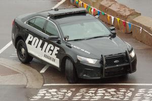 A Ford Taurus police cruiser does a pre-check of SS15, Lakeshore Drive.