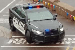 A Ford Taurus police cruiser does a pre-check of SS15, Lakeshore Drive.