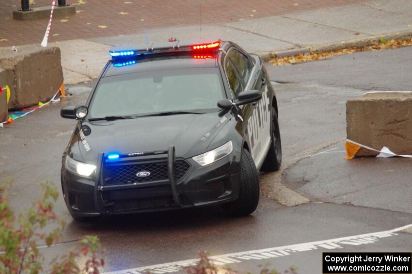 A Ford Taurus police cruiser does a pre-check of SS15, Lakeshore Drive.