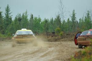 Kevin Schmidt / Kyle Roberts Mazda RX-7 passes by Al Dantes, Jr. / Brandon Snyder Mazda RX-7 LS on SS1, J5 North I.