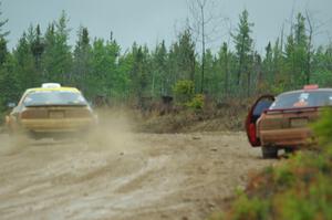 Kevin Schmidt / Kyle Roberts Mazda RX-7 passes by Al Dantes, Jr. / Brandon Snyder Mazda RX-7 LS on SS1, J5 North I.