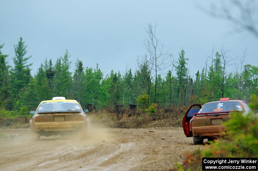 Kevin Schmidt / Kyle Roberts Mazda RX-7 passes by Al Dantes, Jr. / Brandon Snyder Mazda RX-7 LS on SS1, J5 North I.