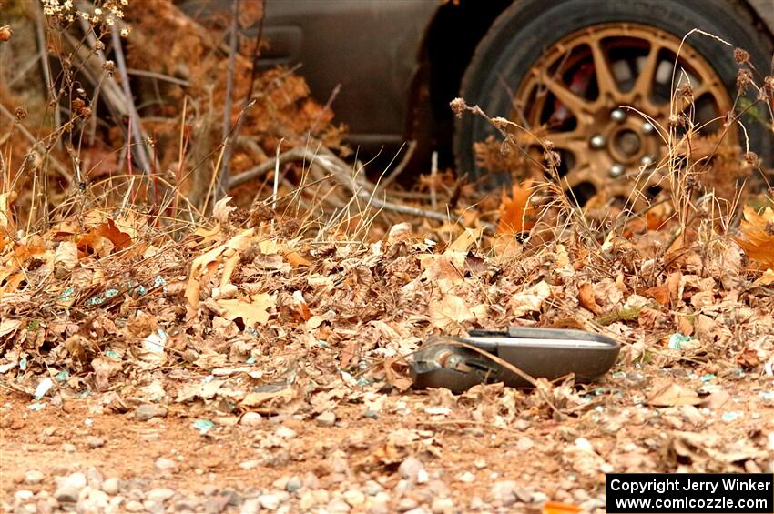 Scattered debris from the Jordan Locher / Tom Addison Subaru Impreza 2.5RS after rolling on SS1.