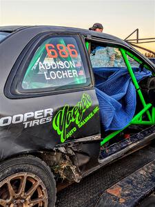 Jordan Locher / Tom Addison Subaru Impreza 2.5RS gets repairs after rolling on day one of the rally.