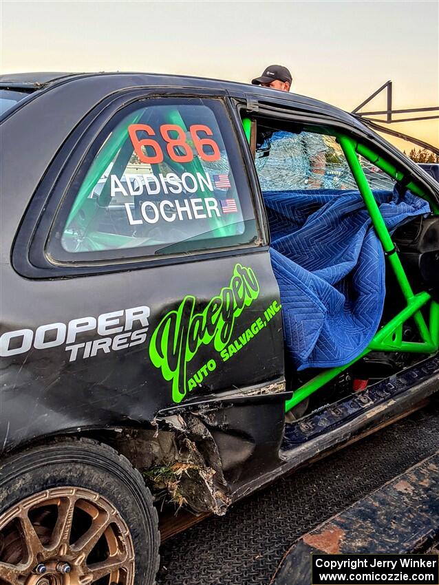 Jordan Locher / Tom Addison Subaru Impreza 2.5RS gets repairs after rolling on day one of the rally.