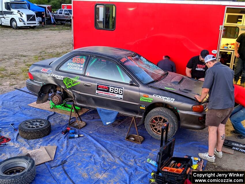 Jordan Locher / Tom Addison Subaru Impreza 2.5RS gets repairs after rolling on day one of the rally.