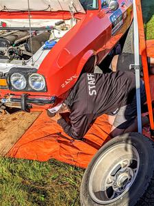 Mike Hurst underneath his Ford Capri prior to the start of day two.