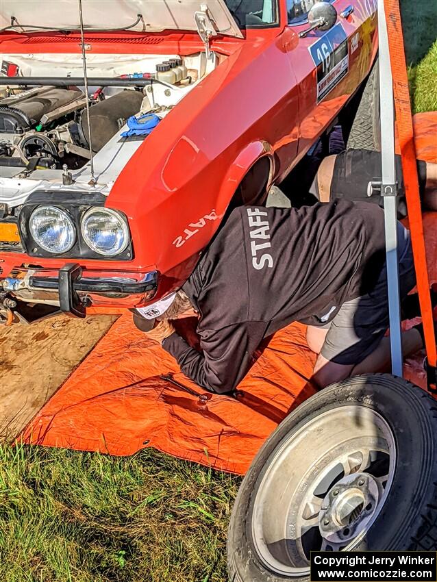 Mike Hurst underneath his Ford Capri prior to the start of day two.