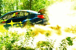 Travis Pastrana / Rhianon Gelsomino Subaru WRX STi at speed on SS10, Strawberrry Mountain II.