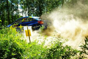 Travis Pastrana / Rhianon Gelsomino Subaru WRX STi at speed on SS10, Strawberrry Mountain II.