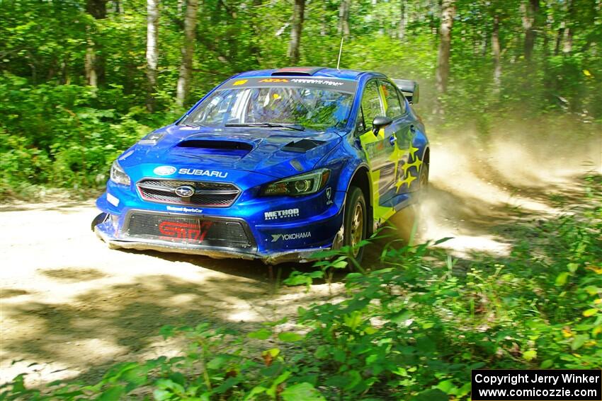 Travis Pastrana / Rhianon Gelsomino Subaru WRX STi at speed on SS10, Strawberrry Mountain II.