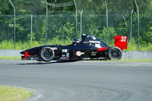 Dave Schaal's Formula Enterprises is stuck on the berm on the outside of turn 8.