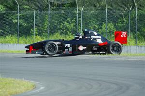 Dave Schaal's Formula Enterprises is stuck on the berm on the outside of turn 8.