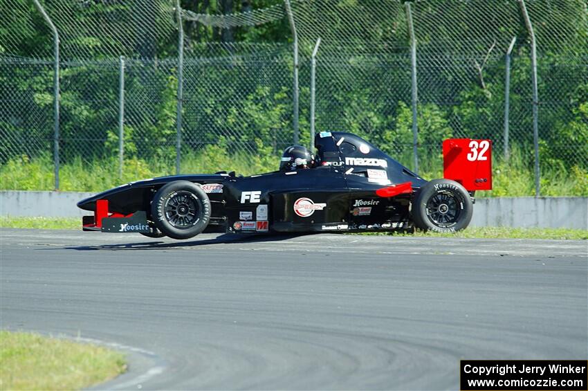 Dave Schaal's Formula Enterprises is stuck on the berm on the outside of turn 8.