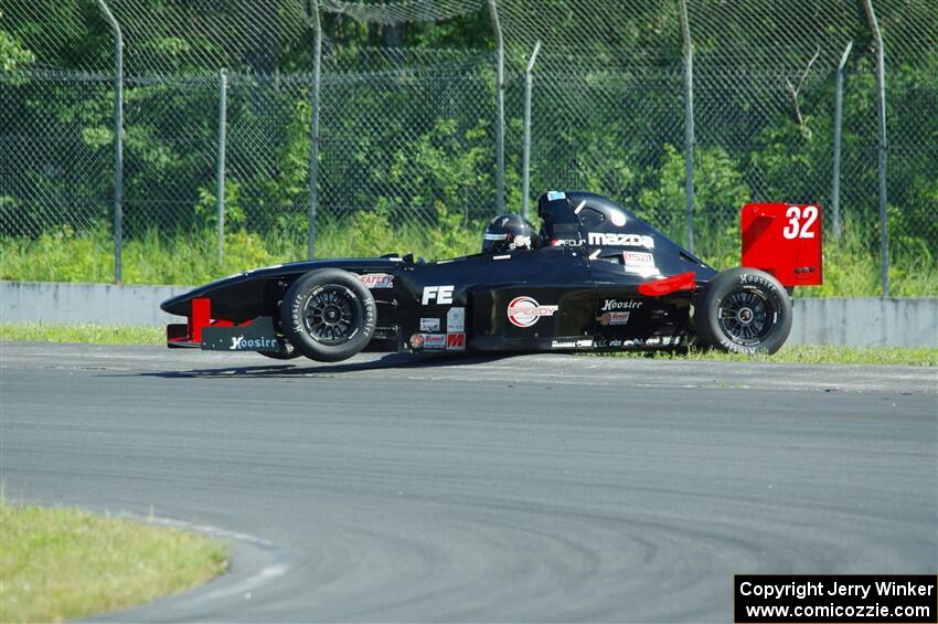 Dave Schaal's Formula Enterprises is stuck on the berm on the outside of turn 8.