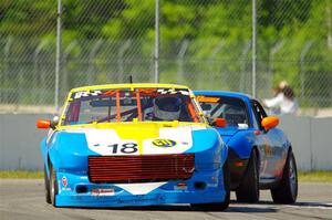 Howard Roth's E Production Datsun 240Z and Gordon Kuhnley's Spec Miata Mazda Miata