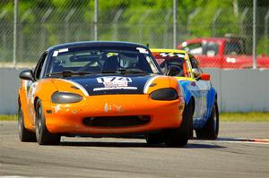 Cam Ebben's Spec Miata Mazda Miata and Howard Roth's E Production Datsun 240Z