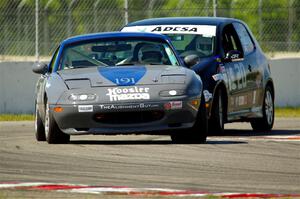 Aaron Jongbloedt's Spec Miata Mazda Miata and Tom Daly's T4 VW Rabbit