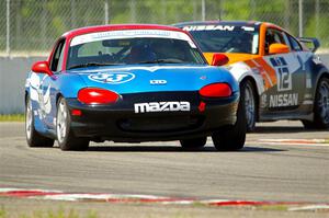 Rick Buan's Spec Miata Mazda Miata and James Berlin's T3 Nissan 350Z