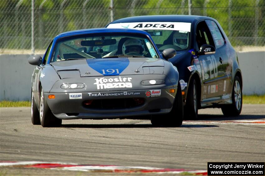 Aaron Jongbloedt's Spec Miata Mazda Miata and Tom Daly's T4 VW Rabbit