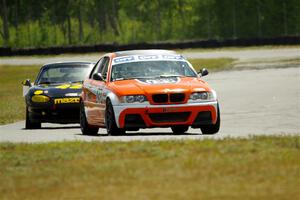 Chris Davis' SPU BMW 330 and Greg Youngdahl's Spec Miata Mazda Miata