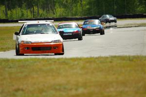 Ben Wedge's ITJ Honda Civic, Rick Buan's Spec Miata Mazda Miata and Gordon Kuhnley's Spec Miata Mazda Miata