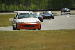 Ben Wedge's ITJ Honda Civic, Rick Buan's Spec Miata Mazda Miata and Gordon Kuhnley's Spec Miata Mazda Miata