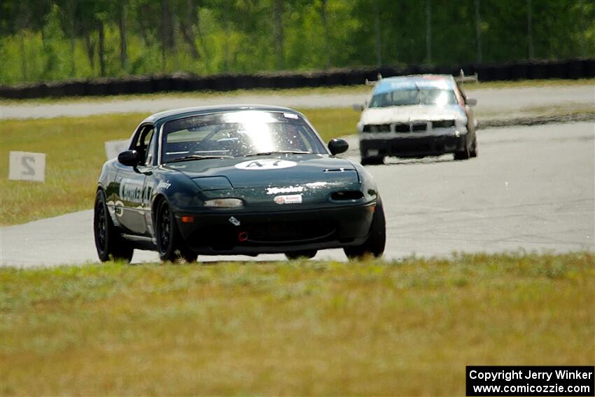 Sam Nogosek's Spec Miata Mazda Miata and Joe Bungert's ITJ BMW 318ti