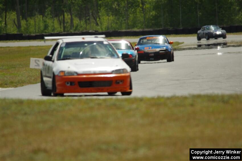 Ben Wedge's ITJ Honda Civic, Rick Buan's Spec Miata Mazda Miata and Gordon Kuhnley's Spec Miata Mazda Miata