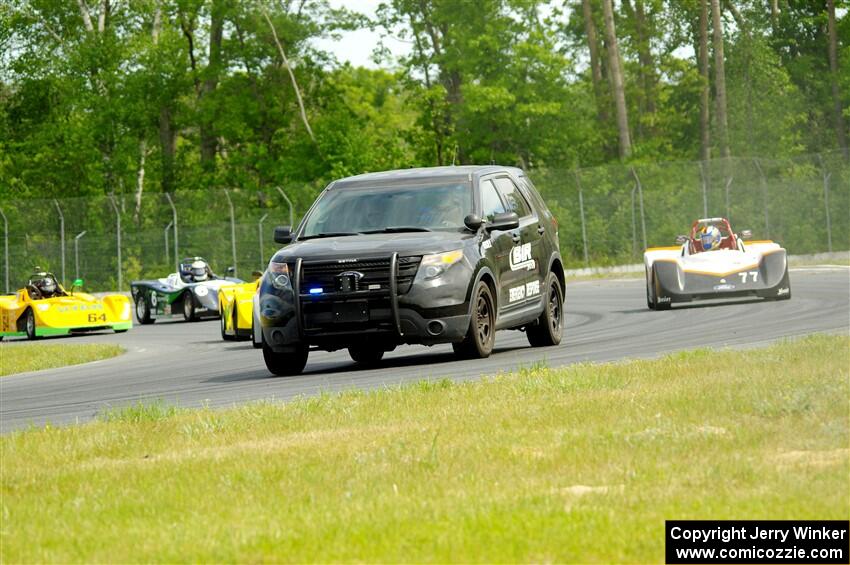 The Spec Racer Ford 3 field behind the pace car.