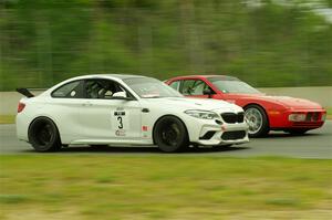 Dan Huberty's BMW M2 CS Racing passes Matt Lawson's ITE-2 Porsche 944 Turbo