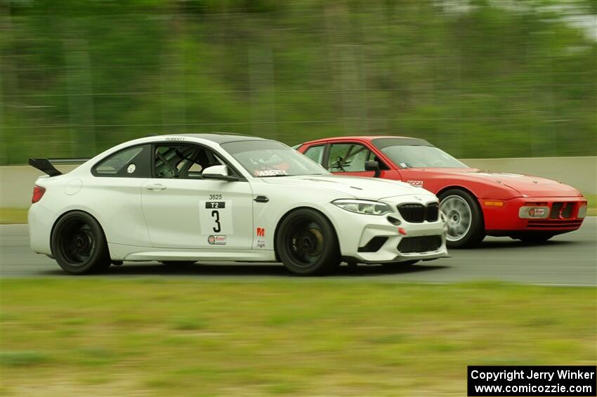 Dan Huberty's BMW M2 CS Racing passes Matt Lawson's ITE-2 Porsche 944 Turbo