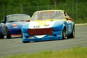 Howard Roth's E Production Datsun 240Z and Geoff Youngdahl's ITA Mazda Miata