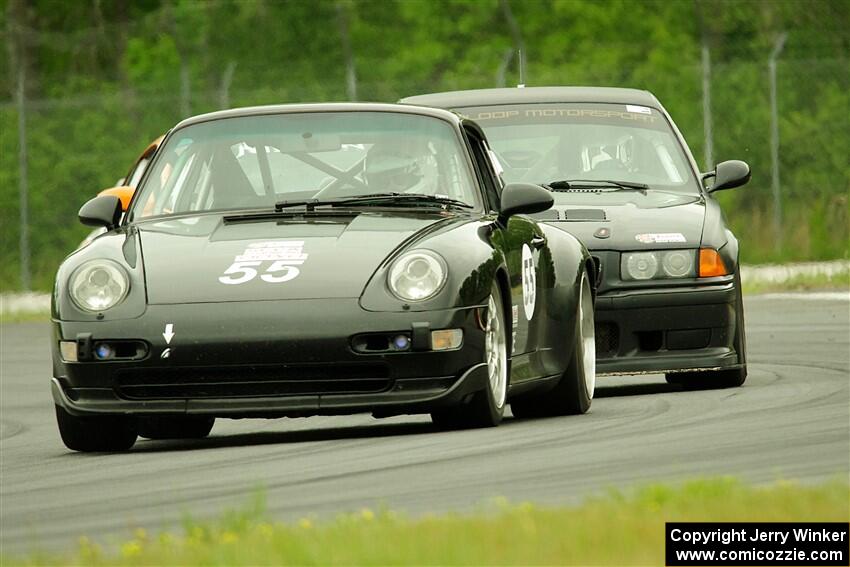 Phil Magney's ITE-1 Porsche 993 and C.J. Harayda's STU BMW M3