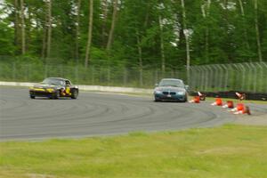 Roger Knuteson's T4 BMW Z4 goes off at turn 8 as Greg Youngdahl's Spec Miata Mazda Miata passes by.