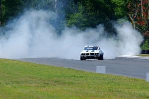 Scott Graham's Pontiac Firebird does a smokey burnout after looping it in turn three.