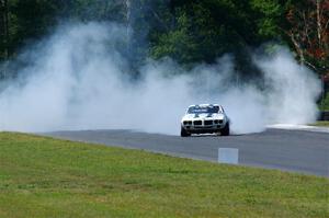 Scott Graham's Pontiac Firebird does a smokey burnout after looping it in turn three.