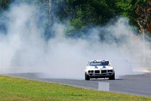 Scott Graham's Pontiac Firebird does a smokey burnout after looping it in turn three.