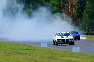 Scott Graham's Pontiac Firebird does a smokey burnout after looping it in turn three.