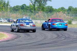 Aaron Jongbloedt's and Rick Buan's Mazda Miatas