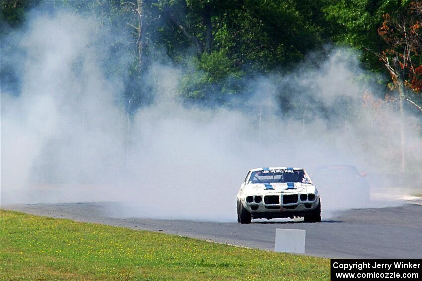 Scott Graham's Pontiac Firebird does a smokey burnout after looping it in turn three.