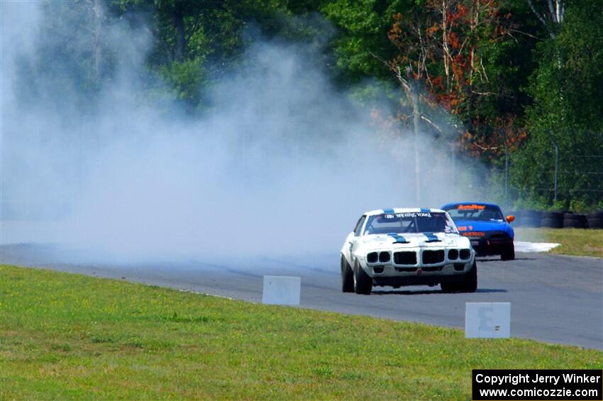 Scott Graham's Pontiac Firebird does a smokey burnout after looping it in turn three.