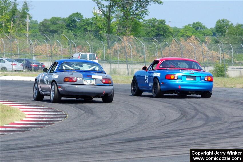 Aaron Jongbloedt's and Rick Buan's Mazda Miatas