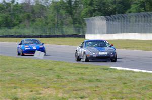 Aaron Jongbloedt's, Rick Buan's and Geoff Youngdahl's Mazda Miatas